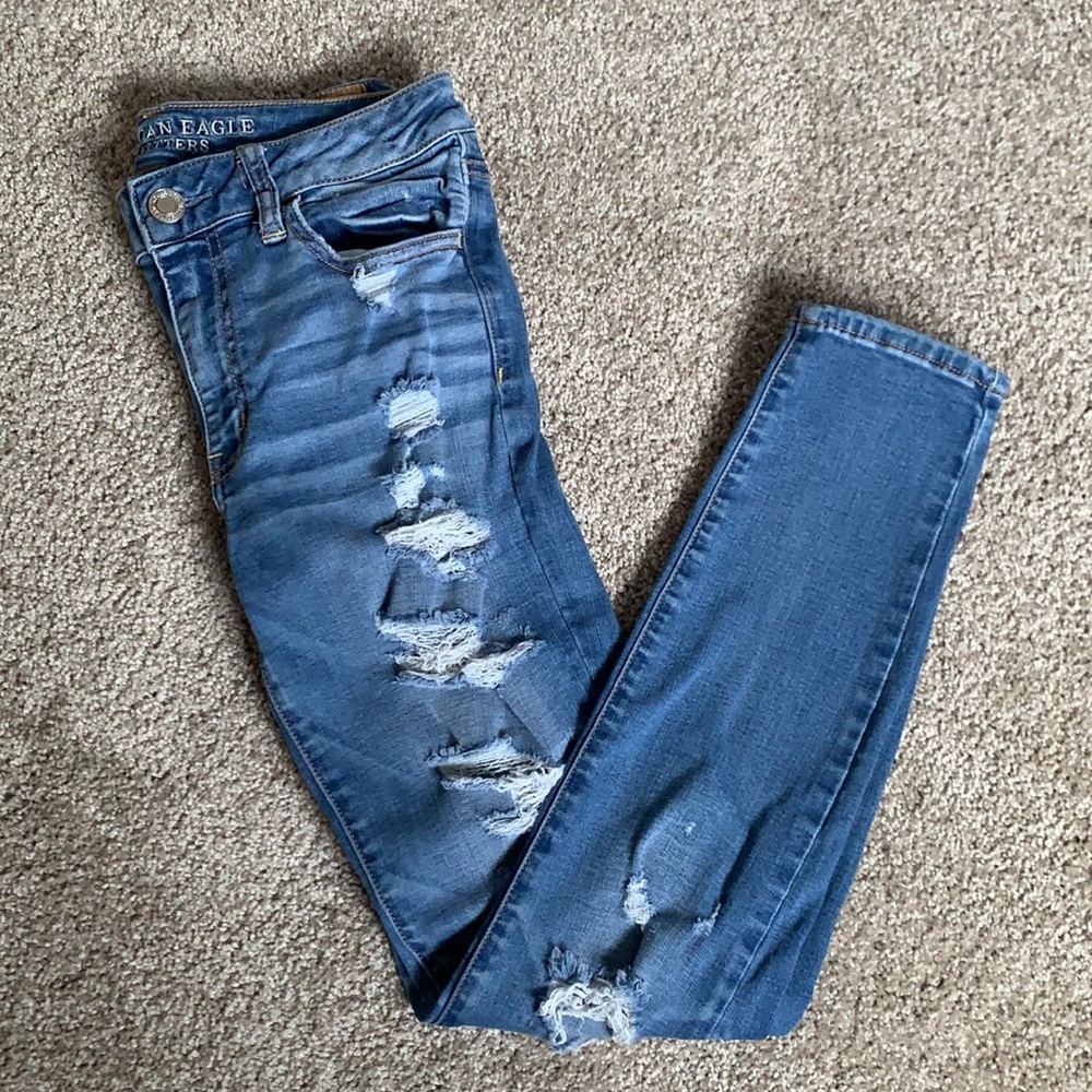 Distressed blue jeans AE